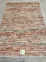 Full view of hand knotted Persian carpet showing overall pattern and color distribution.