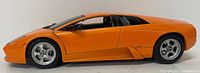 Side view of orange Lamborghini Murcielago model showing metallic finish and silver rims with realistic tires.
