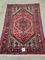 Full view of the Persian hand knotted carpet showing overall design, color and size.