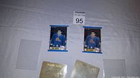 Two Joe Sakic 1989 OPC rookie cards front side showing player in blue Quebec Nordiques uniform, with gold foil Rookie Card stamp.