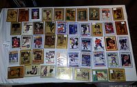Front sides of 70 NHL trading cards showing various players and designs, arranged on a flat surface.