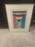 Framed abstract painting 'Celebration of Life' with gradient colors and central circular form.