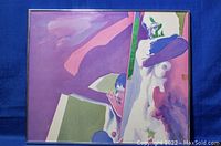 Full view of framed lithograph artwork showing the stylized nude figure and geometric color background.