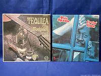 Front covers of 'Tequila' by Wes Montgomery and 'Cryin' Time' by Otis Spann vinyl records with sleeves.
