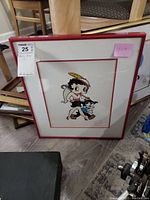 Framed Betty Boop serigraph cel with visible matting and red frame, showing full artwork including character and Certificate of Authenticity label.
