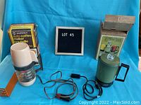 Full lot including mini percolator, car coffee maker, electric cords, and packaging