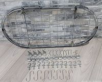 Full oval rack and all hooks laid out on floor