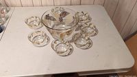 Full view of the set with one large serving bowl and seven smaller serving bowls arranged on a table