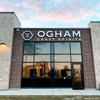 Exterior of Ogham Craft Spirits building showing signage.