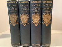 The spines of four hardcover books in the set, each with ornate gold designs and titles indicating their subject and author.