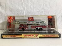 Single view of the limited edition Code 3 Boston Tower Unit ladder truck die cast model in original display case.