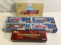 Six Corgi collectible die-cast fire apparatus replicas boxed together, including the red and white fire trucks and the limited edition Seagrave model.