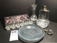 Full lot of Waterford and other crystal and glass items including magnifying glass, vase, bowl, flask, lamp finial, candy bowl, and salt cellars
