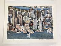 A clear top-down photo showing the complete print with Boston skyline, harbor, sailing boat, and the artist's signature at bottom right.
