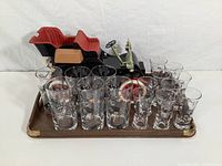 Photo of entire lot showing 15 Libbey Carriage glasses displayed on a wooden tray with a Jim Beam carriage decanter