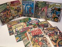 Layout view of upright and flat comic books showing titles and covers