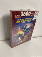 Front angle photo of shrink-wrapped Atari 2600 Defender II video game box with original Zellers price sticker