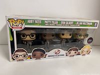 Front view of unopened Ghostbusters 4-pack Funko POP! vinyl figures set, showing Abby Yates, Patty Tolan, Erin Gilbert, and Jillian Holtzmann in box.