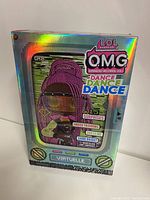 Front view of holographic boxed LOL Surprise OMG Dance Virtual Dance doll with detailed colorful packaging showing doll with purple braided hair, sunglasses, and accessories notes.