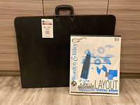 Black Art Show Portfolio with handle and sticker showing size 20 x 26 inches