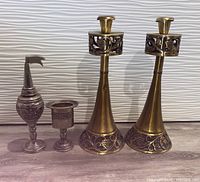 Photo showing the full set including two brass candlesticks and Havdala items (spice box, kiddush cup, candle holder)