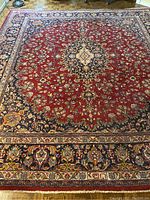 Full top-down view of rug on wood floor showing overall pattern and size