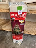 Photo of original box showing branding, tree image and features.