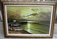 Front view of large framed oil painting showing Italian boat harbour scene with boats on shore and water reflecting moonlight, under cloudy sky.