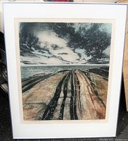 Front view of framed etching showing landscape of rocky shoreline