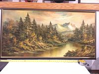 Front view of full framed painting with measuring tape at bottom edge