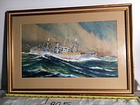 Full view of the framed painting showing the entire ship on rough sea and the frame with measuring tape for size reference