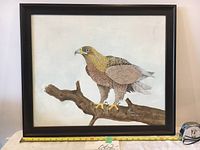 Frontal photo showing the full painting within the dark wood frame with a measuring tape placed at the bottom showing size.