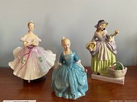 All three figurines grouped on table