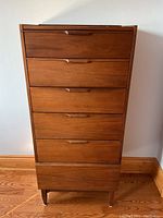 Front elevation showing five full-width drawers with recessed handles