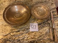 Overhead view of both pedestal bowls and the carving set showing overall shape, size relation and condition