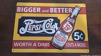 Front view of 12x16.5 inch vintage Pepsi-Cola metal sign with promotional text and bottle graphic.