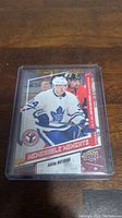 Front of Auston Matthews rookie hockey card showing player image and design details.