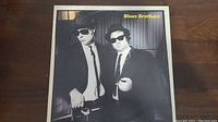 Front cover of the Blues Brothers vinyl album showing two men in suits and sunglasses.