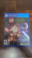 Front cover of PS4 game case showing LEGO Star Wars The Force Awakens artwork and PlayStation 4 branding.