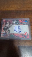 Front of autographed Martin Brodeur hockey card showing player image, autograph, and New Jersey Devils logo.