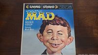 Front cover of the Musically MAD vinyl record featuring a caricature of the MAD magazine mascot Alfred E. Neuman, with title and RCA Victor Living Stereo logos.