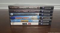 Photo showing six Nintendo GameCube game cases stacked horizontally with titles visible