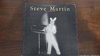 Front cover of Steve Martin "A Wild And Crazy Guy" vinyl record showing Steve Martin in a bunny suit.
