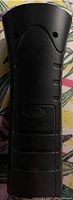 Back view of BarxBuddy device showing ergonomic design and speaker holes.