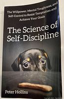 Front cover of 'The Science of Self-Discipline' book by Peter Hollins showing book title, subtitle, and cover image of a dog looking at a treat.