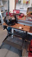 Ohio Forge 6 inch bench grinder mounted on Black & Decker workmate bench with tools and vise in background.