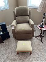 Front view of recliner and footstool showing overall condition