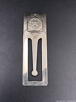 Front view of the sterling silver money clip showing decorative Birks emblem and cutout design