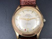 Front view of the Cerva 30 Jewels Superautomatic watch showing the dial with gold-tone numerals, minute markers, and hands including a red arrow-tip second hand. The dial reads 'Cerva 30 Jewels Superautomatic Incabloc Waterproof Swiss'.