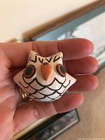 Front view of Acoma owl figurine by Dolores Lewis showing painted features